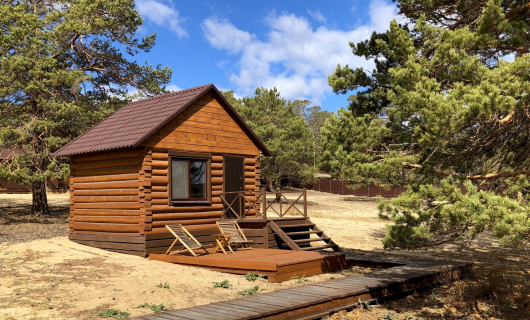 Отдельностоящий домик из бревна DBL одноместное/двухместное размещение